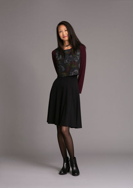 Two piece dark floral dress a cropped top and straight skirt with long sleeve shirt underneath